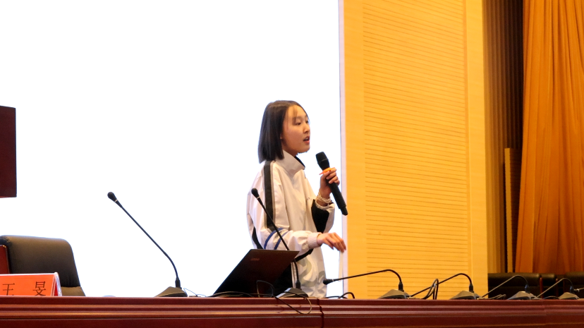 A U Bridge speaker giving a public talk